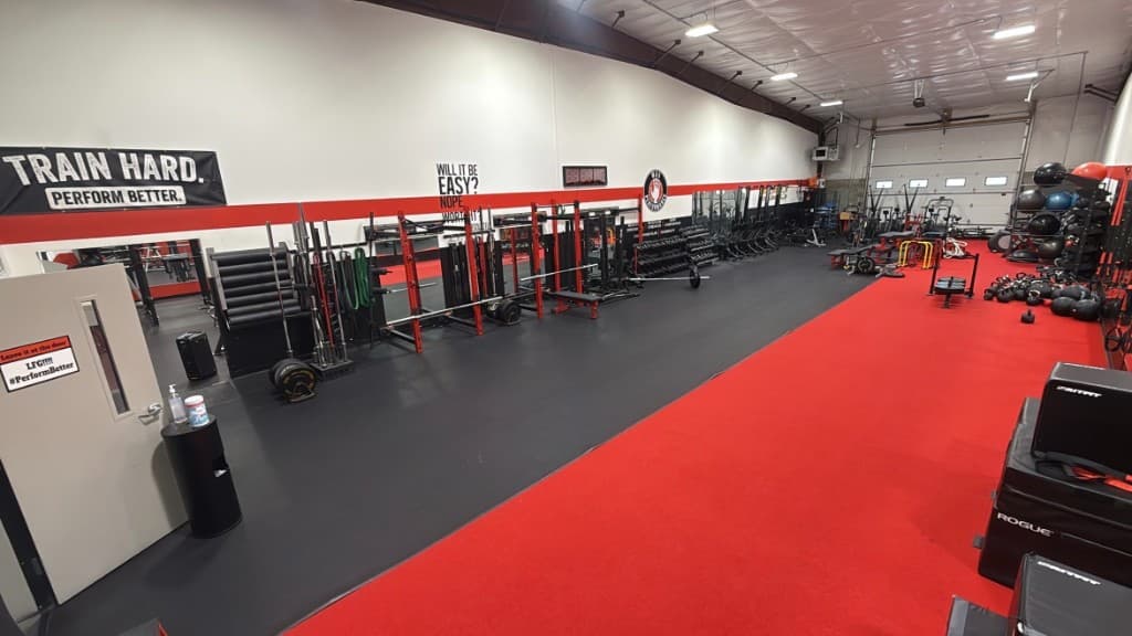 Strength racks, turf lane, and functional training area at MA5